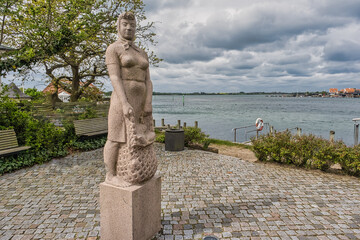 Wall Mural - Kerteminde statue of traditional Amanda fishing wonan, Denmark