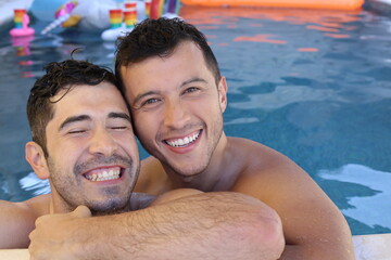 Wall Mural - Gorgeous interracial gay couple in swimming pool 