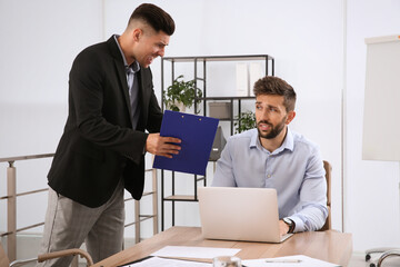 Wall Mural - Boss screaming at employee in office. Toxic work environment