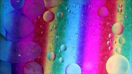 Poster - Top-down view of oil bubbles moving over different layers on the water surface. Oil drops on a water surface abstract background