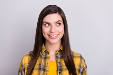 Poster - Photo of sweet cute young woman dressed checkered shirt smiling looking empty space isolated grey color background