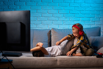 Wall Mural - cheerful boy and girl having fun at home together