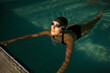 © ADDICTIVE STOCK - Woman swimmer in the pool