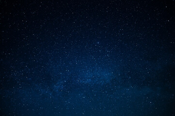 dark blue night sky and small twinkling stars. abstraction. minimalism. there is no one in the photo