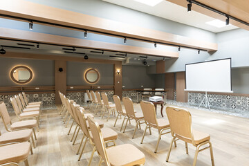 Interior of a conference room with golden chairs