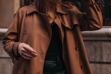stylish brown autumn fashionable coat on a female figure. street fashion details
