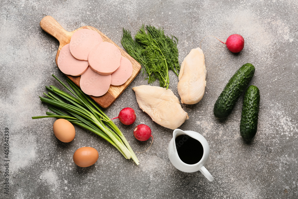 Different ingredients for okroshka on grunge background