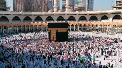 Wall Mural - MECCA, SAUDI ARABIA - September 10, 2019: Video of unidentified pilgrims perform Tawaf around Kaaba inside Masjidil Haram, Makkah