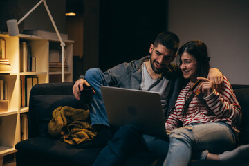 Wall Mural - happy young couple enjoying time at home