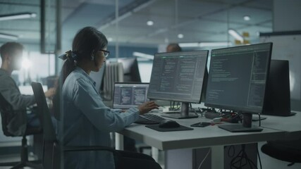 Leinwandbilder - Diverse Office: Indian IT Programmer Working on Desktop Computer. Female Specialist Creating Innovative Software Engineer Developing App, Program, Video Game. Terminal with Coding Language. Arc Shot