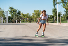 Woman In Rollerblades And Showing Stunt