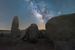 Megalithic monuments under starry sky with Milky Way