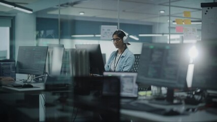 Aufkleber - Diverse Office: Indian IT Programmer Working on Computer. Female Specialist Creating Innovative Software. Engineer Developing App, Program, Video Game. Wearing Headphones Listening Podcast, Music