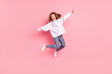 Sticker - Full length body size view of attractive funky girlish cheerful trendy girl jumping good mood isolated over pink pastel color background