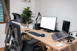 Wooden desk with laptop, display, mouse, lamp, ergonomic chair and artificial tree in workplace on bedroom