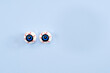 Floating bloodshot eye balls on a blue wall with advertisement copy space
