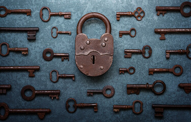 Fototapete -  Antique door locks and keys on an old background. Old padlock and key. set as a symbol of security, closeness, history, protection, safety etc. Conceptual background. Blue toning.