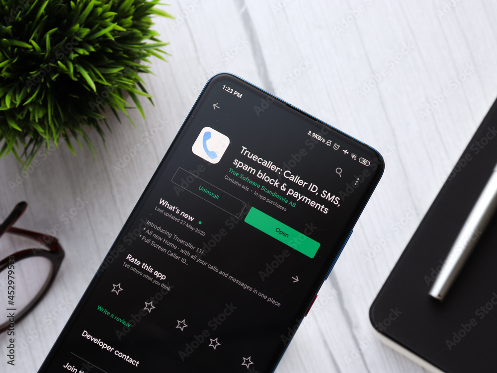 Downloading truecaller mobile app from google play store photographed ...
