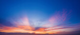 Fototapeta Na sufit - Bright blue sky with purple clouds at sunset.