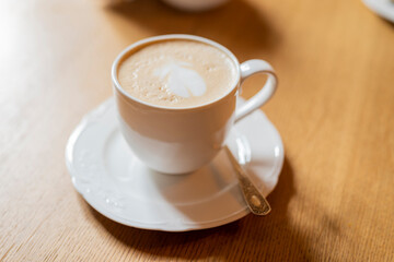 Wall Mural - morning cup with cappuccino latte in a restaurant