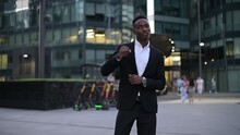 Close-up Of A Young Black Guy Dancing Against The Backdrop Of The Downtown. Slow Motion