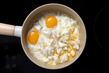 Homemade Sunny Side Up Fried Eggs With Crabmeat In Pan On Stove, Gourmet Food Recipe, Good Work From Home Lunch Idea, Egg White And Egg Yolk In Cooking, Black Background