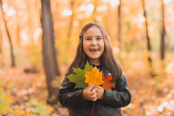 Autumn portrait of cute little asian girl. Children, fall and season concept.