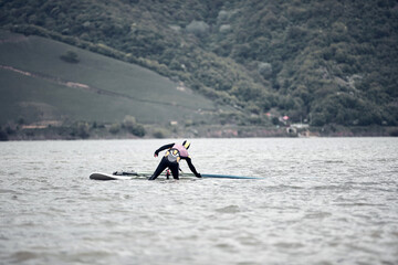 Windsurfer surfing on a windy day at the river.