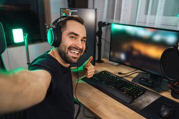 Happy young man taking selfie photo