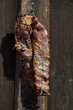 © Boris - Smoked piece of meat hanging on wooden background