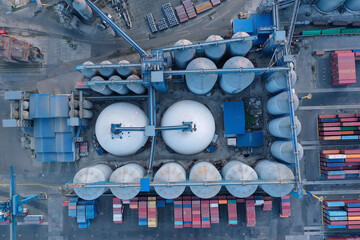 Aerial view oil terminal is industrial facility for storage of oil and petrochemical products ready for transport to further storage facilities.