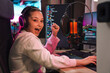 © Drobot Dean - Happy young woman streamer gamer in headphones