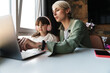 © Drobot Dean - Mother helping her daughter with her homework