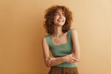Smiling young casual woman with curly hair