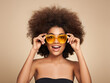 © Oleg Gekman - Beauty portrait of African American girl in colored sunglasses. Beautiful black woman. Cosmetics, makeup and fashion