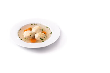 Traditional Jewish matzah ball soup isolated on white background. Copy space