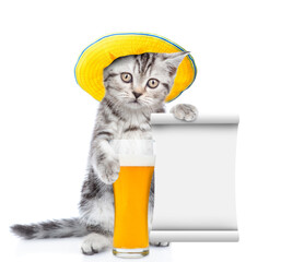 Poster - Funny kitten weaing summer hat holds mug of a beer and shows empty list. isolated on white background