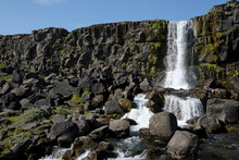 A Large Waterfall Over A Rocky Cliff - Öxaráfoss In Thingvellir National Park.