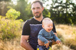 © Anastasia - Father and his son spend time together in the park. Time for father and son. Happy father's day. Happy father burns with his son. Parental everyday life.