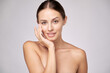 © Anatoly Repin - Beautiful Young Woman with Clean Fresh Skin standing over light grey background