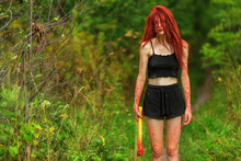 Red-haired Girl With Bloody Axe