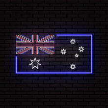 Neon Sign In The Form Of The Flag Of Australia. Against The Background Of A Brick Wall With A Shadow. For The Design Of Tourist Or Patriotic Themes.