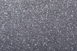 Beautiful shiny grey glitter as background, closeup