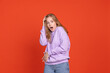 © Lustre Art Group  - Half-length portrait of scared and shocked young girl isolated on red studio background. Concept of human emotions