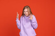 © Lustre Art Group  - Half-length portrait of irritated and shocked young girl isolated on red studio background. Concept of human emotions