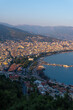 © Sergey - Alanya city (Turkey) harbor in the evening. Buildings. Bay with boats and ships. Mountains and sea. Vertical photo