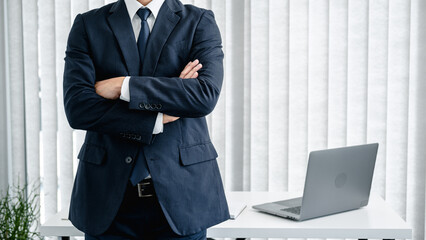 Poster - Cropped image of businessman in suit standing with arms crossed and feeling confidence in work about new business