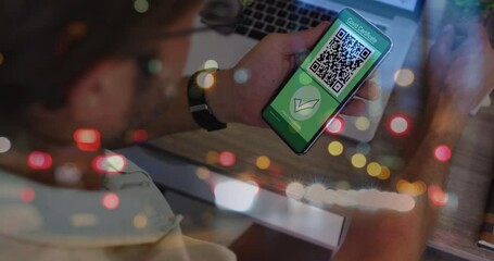 Poster - Animation of man holding smartphone with covid 19 vaccination passport over blurred lights