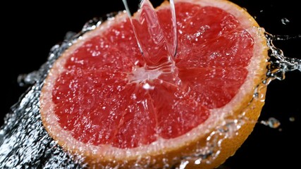 Poster - Super Slow Motion Shot of Fresh Grapefruit with Water Splash at 1000fps. Filmed on High Speed Cinematic Camera.