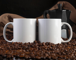 Mug Mock up of two 11 oz white glossy coffee mugs on dark background with coffee beans, and Italian coffee maker.